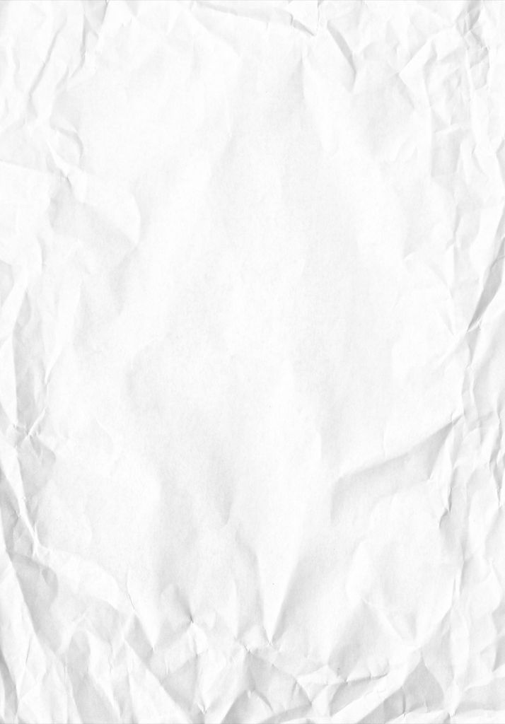 High-resolution image of crumpled white paper with textures and copy space.